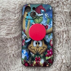 Festive Grinch Cartoon Phone Case with Red pop socket iPhone 15